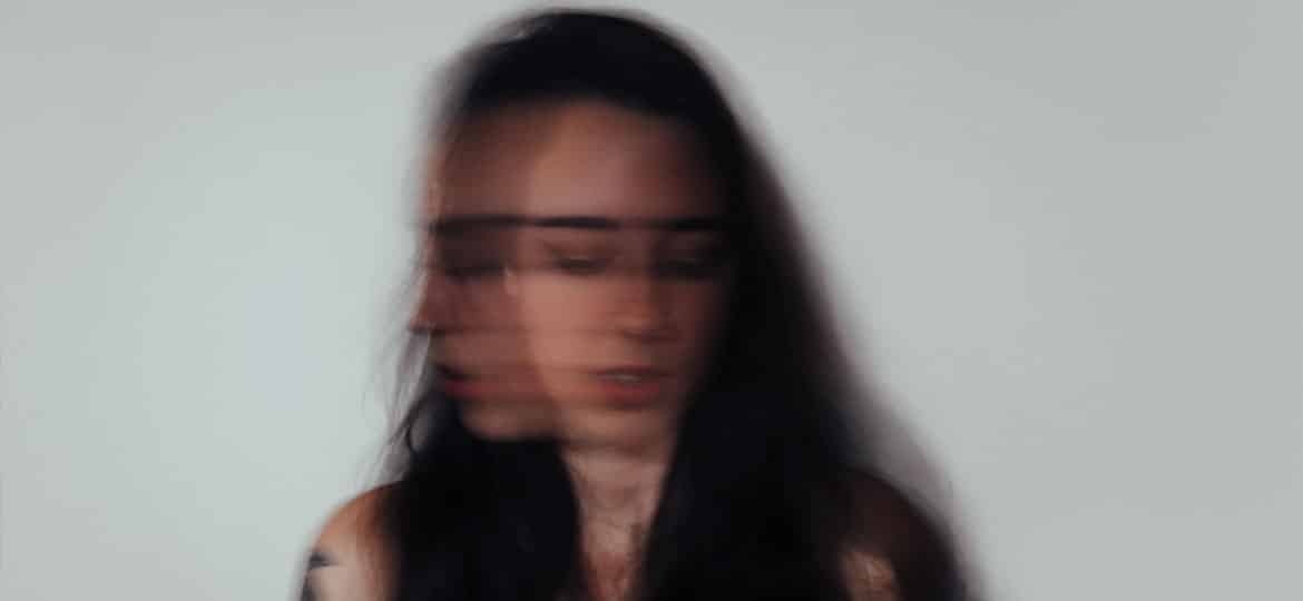 woman shaking head anxiety attack