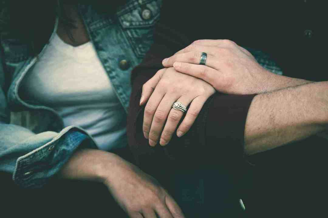 couple touching hands
